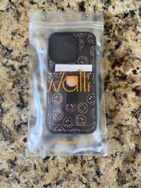 Walli Black Smiley Wallet iPhone 16 Case